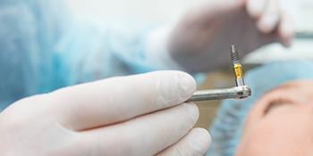 An up-close image of a dental implant that a dentist is preparing to insert in Phillipsburg