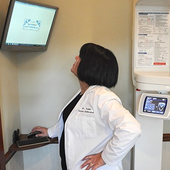 Dr. Garcia-DeMartino looking at computer screen