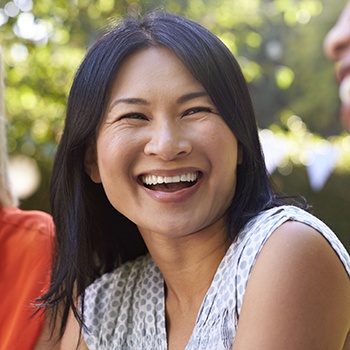 Laughing woman outdoors