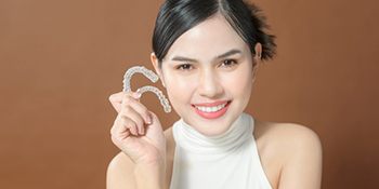 Lady shows off Invisalign clear aligners