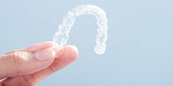 Patient holding clear aligner
