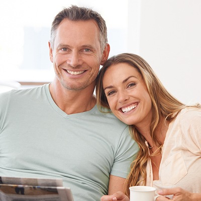 Older man and woman smiling together