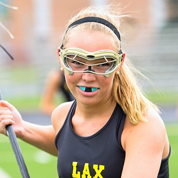 Teen girl with blue mouthguards