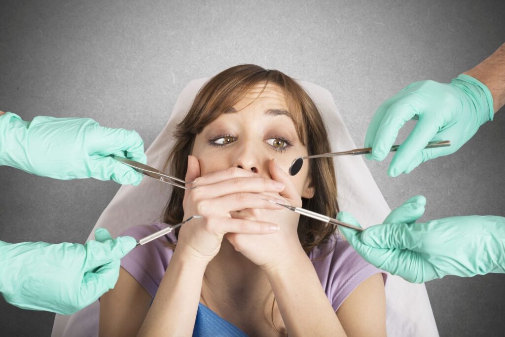 A woman who is afraid of the dentist.